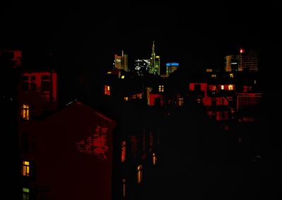 High angle view of illuminated buildings in city at night