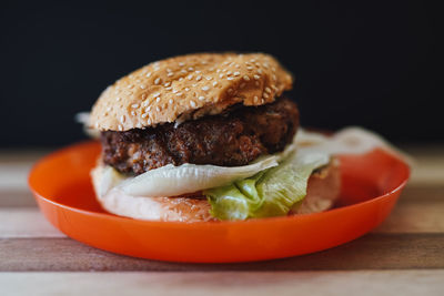 Close-up of burger in plate on table