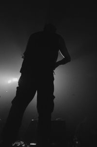 Low angle view of illuminated people at night