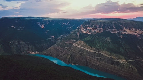 Aerial view of landscape against cloudy sky