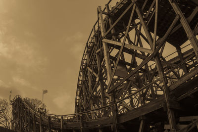 Low angle view of ferris wheel against sky