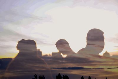 Low angle view of silhouette rocks against sky during sunset