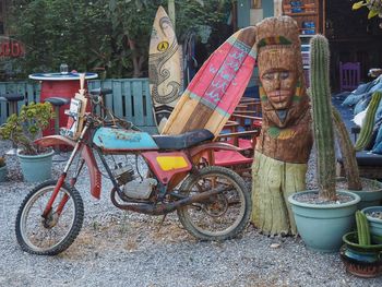 Bicycles parked by statue in city