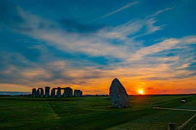 Scenic view of sunset over land