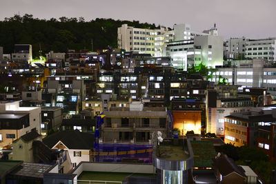 High angle view of buildings in city at night