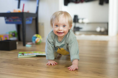 Close-up of cute baby boy at home