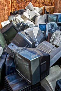 High angle view of abandoned television sets