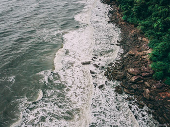 High angle view of rocks in sea