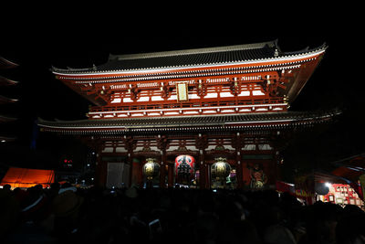 Group of people in temple at night