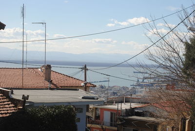 View of town against cloudy sky