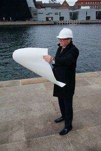 Full length of man standing in boat