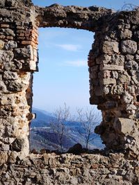 Old stone wall against sky