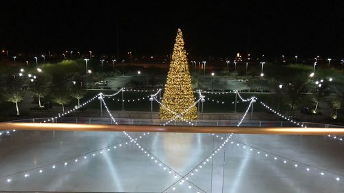 Illuminated christmas tree at night