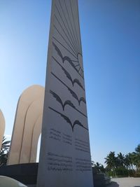 Low angle view of building against blue sky