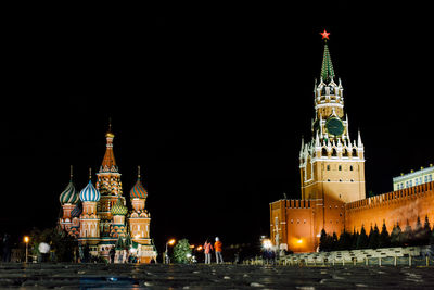 Illuminated historic buildings at red square in moscow kremlin against sky at night