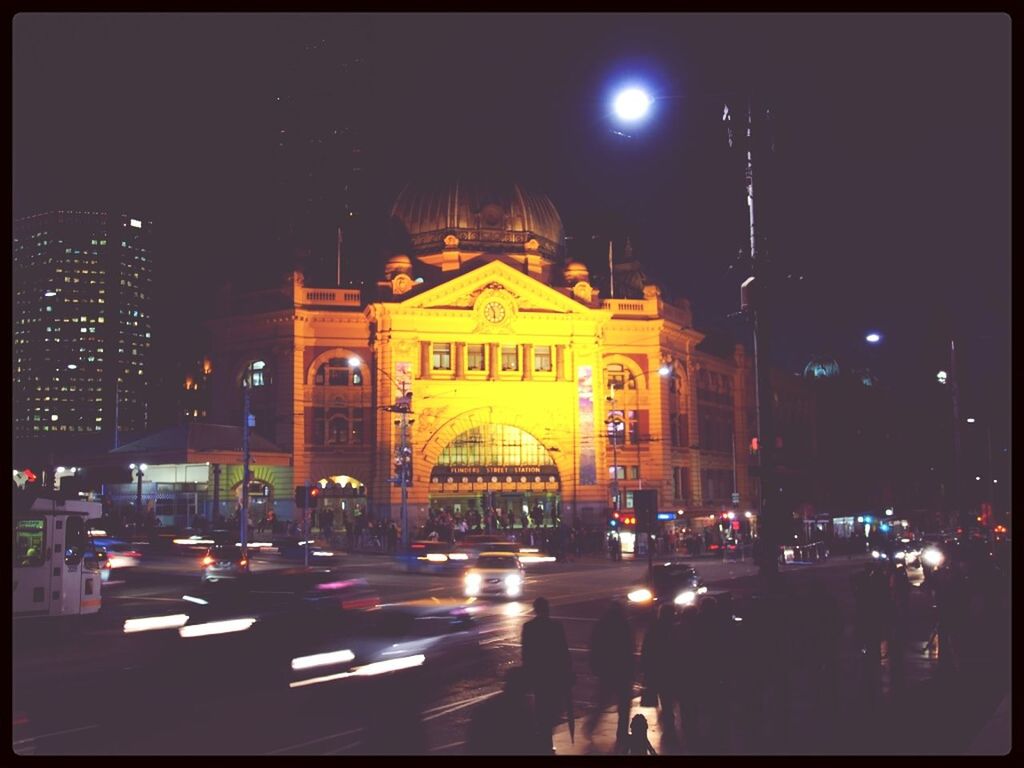 illuminated, night, building exterior, architecture, built structure, car, city, transfer print, street light, street, transportation, city street, land vehicle, city life, traffic, lighting equipment, mode of transport, auto post production filter, road, sky