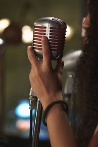 Close-up of person playing guitar