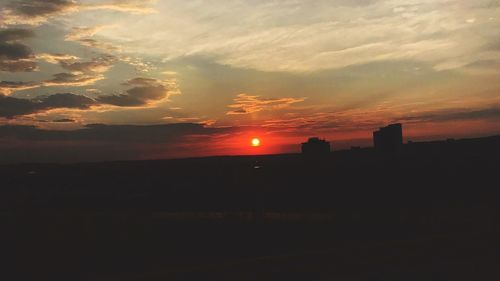 Scenic view of silhouette landscape against sky during sunset