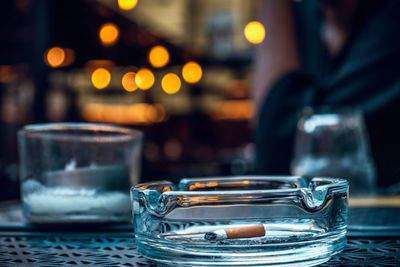 Close-up of wine glasses on table