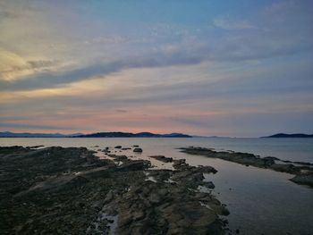 Scenic view of sea and mountains during sunset