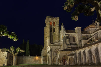 Low angle view of temple against sky at night