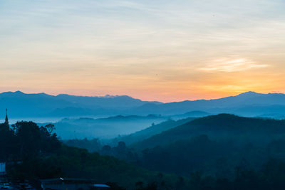 Scenic view of mountains against sky during sunset