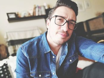 Portrait of young man sitting outdoors