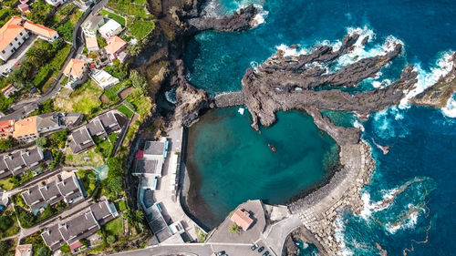 High angle view of houses by sea