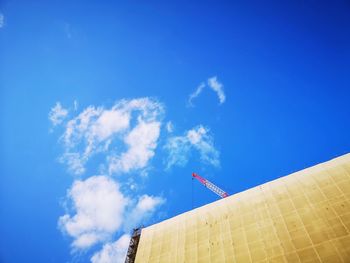 Low angle view of building against blue sky