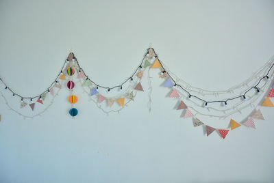 Low angle view of decoration hanging against clear sky