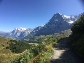 Scenic view of snowcapped mountains against clear sky