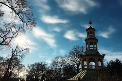 Low angle view of church against cloudy sky