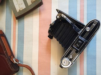 Directly above shot of vintage camera on table