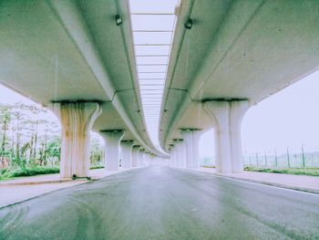 Empty road below bridge