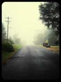 Empty road in foggy weather