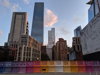 Low angle view of buildings against sky in city