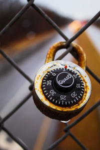 Close-up of lock on chainlink fence