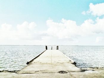 Scenic view of pier over sea against sky