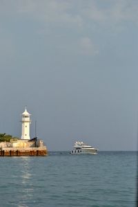 Scenic view of sea with buildings in background