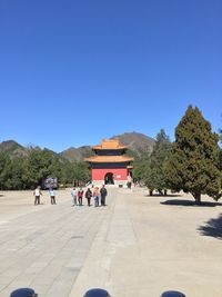 People on road against clear sky