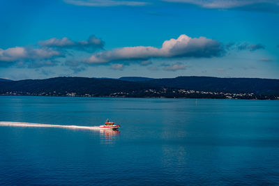 Scenic view of sea against blue sky