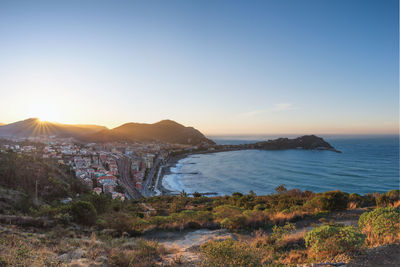 Scenic view of sea against clear sky during sunset