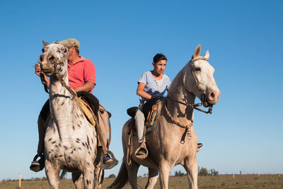 People riding horses