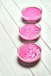 High angle view of pink flowers in bowl on table