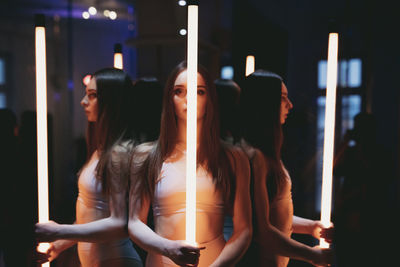 Rear view of woman sitting on stage