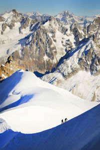Two people on snowcapped mountains