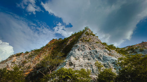 Low angle view of rocks against sky