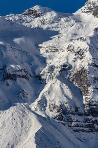 Scenic view of snow covered mountains