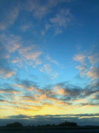 Low angle view of dramatic sky during sunset