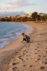 Man on beach against sky